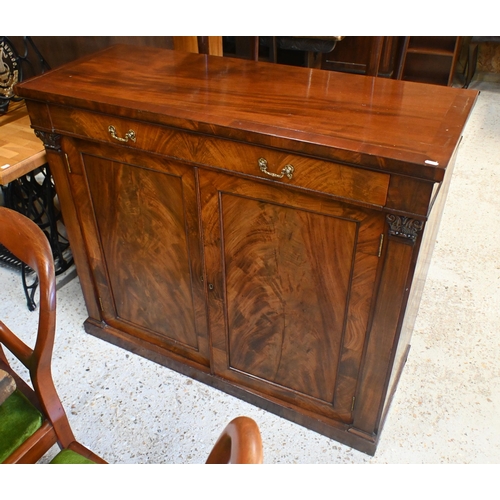 55 - An antique mahogany cross-banded cabinet, the full width drawer with brass fittings over a flame pan... 