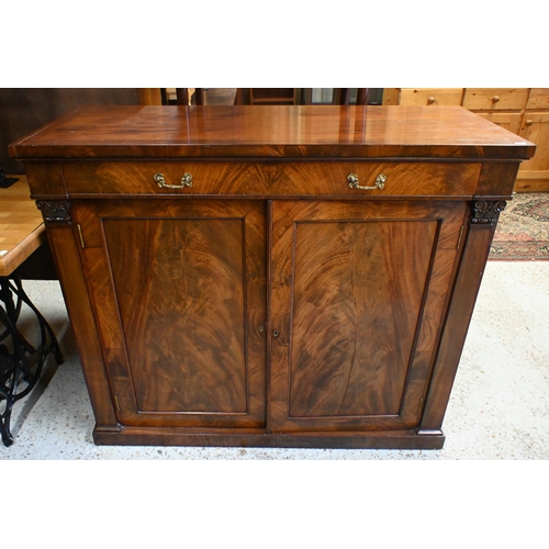 55 - An antique mahogany cross-banded cabinet, the full width drawer with brass fittings over a flame pan... 