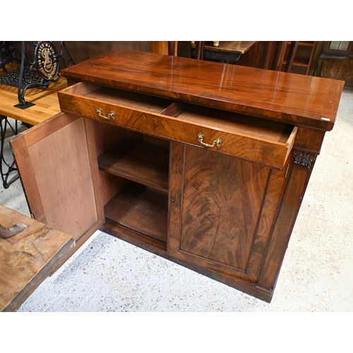 55 - An antique mahogany cross-banded cabinet, the full width drawer with brass fittings over a flame pan... 