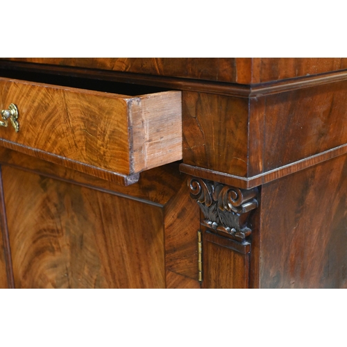 55 - An antique mahogany cross-banded cabinet, the full width drawer with brass fittings over a flame pan... 