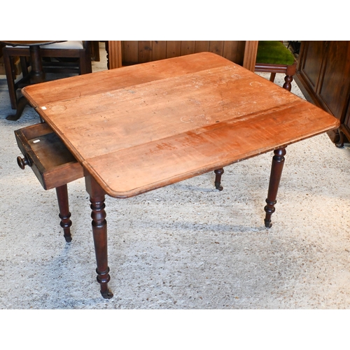 61 - # A Victorian mahogany Pembroke table, drawer to one end, raised on turned legs to brass castors 99 ... 