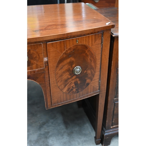 67 - A 19th century mahogany bowfront sideboard with central drawer flanked by cupboards, raised on taper... 