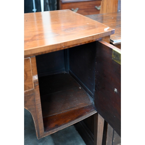 67 - A 19th century mahogany bowfront sideboard with central drawer flanked by cupboards, raised on taper... 