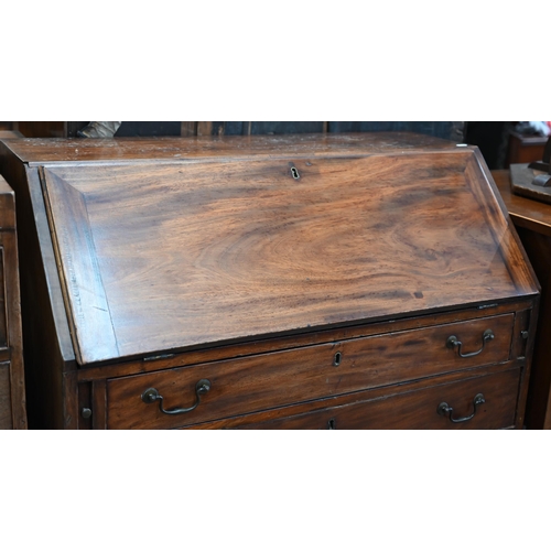 68 - A 19th century mahogany fall-front bureau with fitted interior over four long graduating drawers rai... 