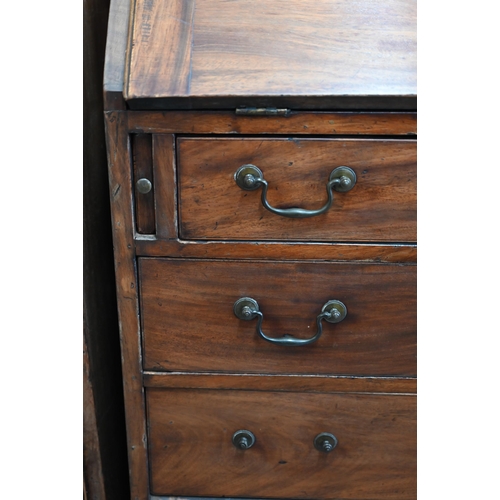 68 - A 19th century mahogany fall-front bureau with fitted interior over four long graduating drawers rai... 