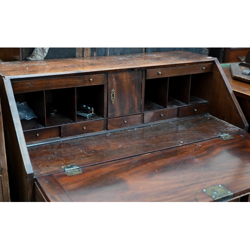 68 - A 19th century mahogany fall-front bureau with fitted interior over four long graduating drawers rai... 