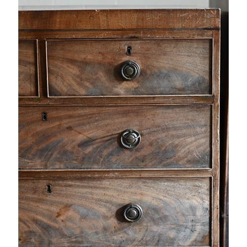 69 - A 19th century mahogany chest of two short over three long drawers raised on tall shaped bracket fee... 