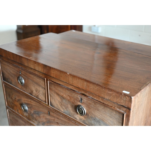 69 - A 19th century mahogany chest of two short over three long drawers raised on tall shaped bracket fee... 