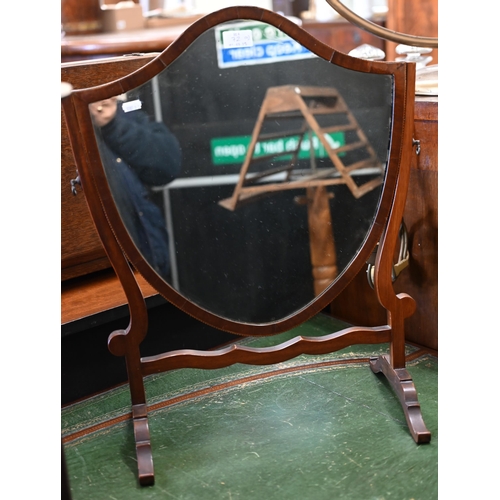 72 - An Edwardian mahogany bowfront writing table with gilt tooled green leather top and three drawers on... 