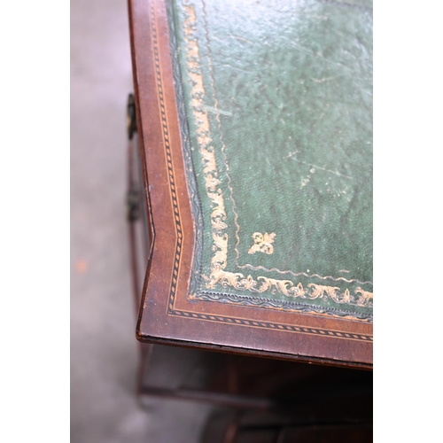 72 - An Edwardian mahogany bowfront writing table with gilt tooled green leather top and three drawers on... 