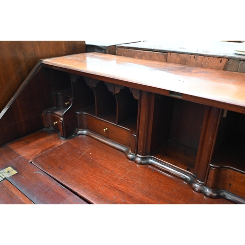 73 - A George III mahogany fall-front bureau with fitted interior featuring a secret three drawer compart... 