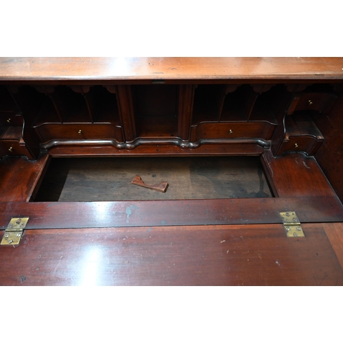 73 - A George III mahogany fall-front bureau with fitted interior featuring a secret three drawer compart... 