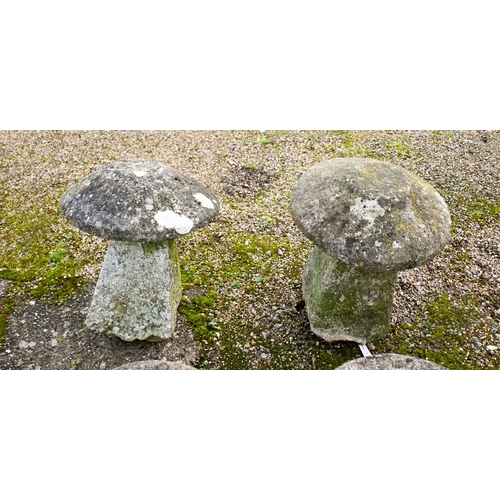 8 - A companion pair of antique hand cut granite staddle stones and caps (2)