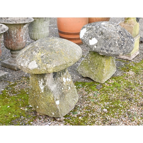 8 - A companion pair of antique hand cut granite staddle stones and caps (2)