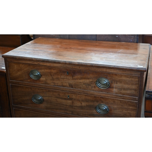 81 - A 19th century mahogany chest of four long graduating drawers with brass handles raised on bracket f... 