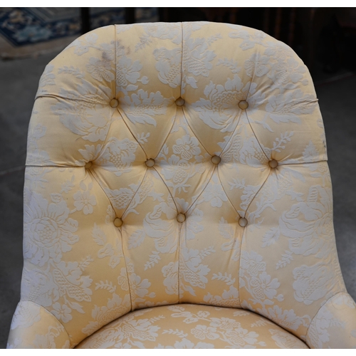 84 - A Victorian walnut framed nursing chair upholstered in yellow floral button back fabric, turned fron... 