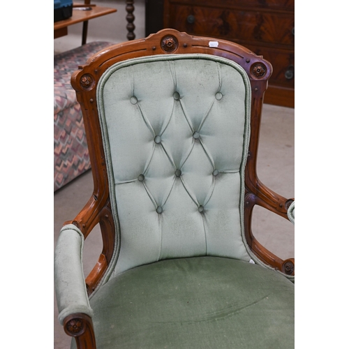 85 - A late Victorian walnut framed open armchair upholstered in pale teal button back fabricBrass caster... 