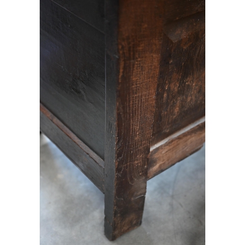 87 - A 17th century and later carved oak coffer, traditional jointed panelled construction with hinged to... 