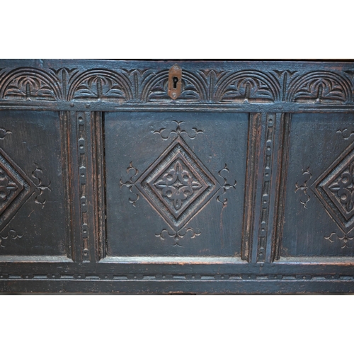 87 - A 17th century and later carved oak coffer, traditional jointed panelled construction with hinged to... 