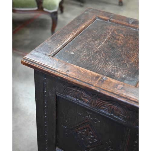 87 - A 17th century and later carved oak coffer, traditional jointed panelled construction with hinged to... 