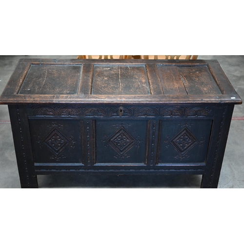 87 - A 17th century and later carved oak coffer, traditional jointed panelled construction with hinged to... 