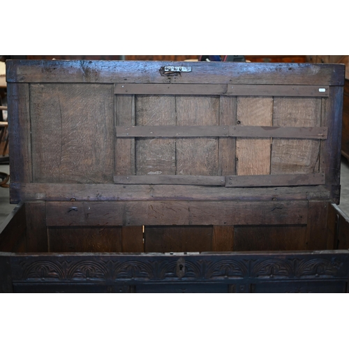 87 - A 17th century and later carved oak coffer, traditional jointed panelled construction with hinged to... 