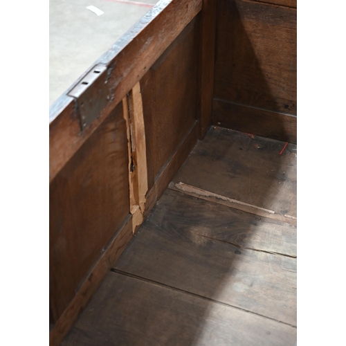 87 - A 17th century and later carved oak coffer, traditional jointed panelled construction with hinged to... 