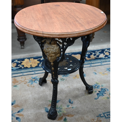 93 - A Victorian black and gilt (re-painted) cast iron Britannia table with later circular hardwood top, ... 