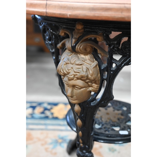 93 - A Victorian black and gilt (re-painted) cast iron Britannia table with later circular hardwood top, ... 