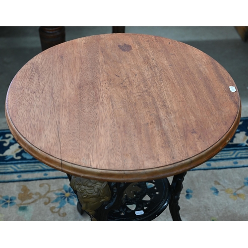 93 - A Victorian black and gilt (re-painted) cast iron Britannia table with later circular hardwood top, ... 