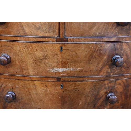 99 - A Victorian mahogany bowfront chest of two short over three long graduating drawers with turned hand... 