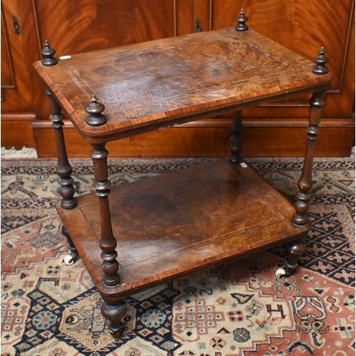 556 - # A Victorian inlaid walnut inlaid two tier whatnot on ceramic castors