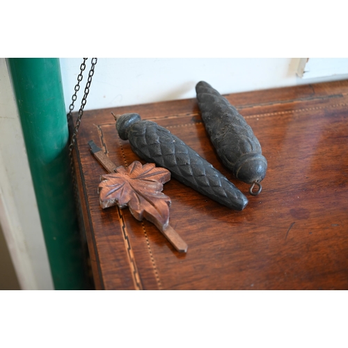 558 - A 20th century Black Forest style carved oak twin-weight cuckoo clock surmounted by a fox crest c/w ... 