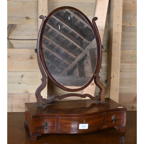 559 - A Regency chequer strung satinwood oval toilet mirror raised on a serpentine platform base