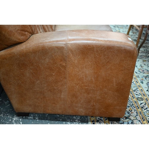 560 - A modern antiqued tan leather three seater sofa to/with a matching two seat sofa, an armchair and ot... 