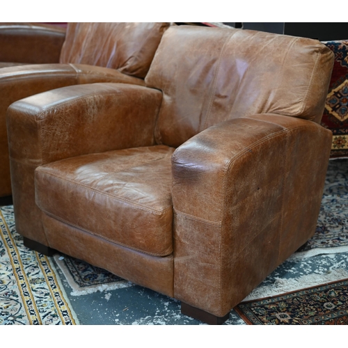 560 - A modern antiqued tan leather three seater sofa to/with a matching two seat sofa, an armchair and ot... 