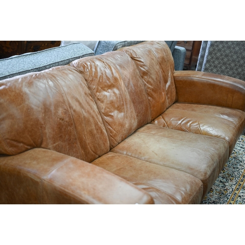 560 - A modern antiqued tan leather three seater sofa to/with a matching two seat sofa, an armchair and ot... 