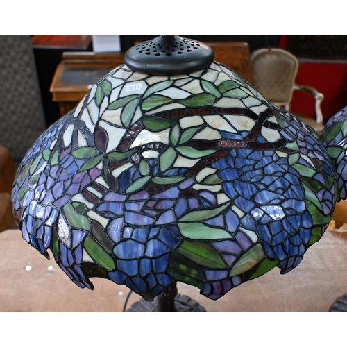 561 - A large pair of Tiffany-style lamps with stained glass 'wisteria', shades, 74cm high