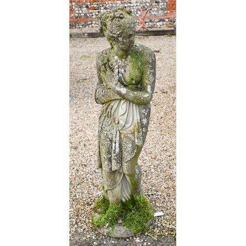 10 - A weathered cast stone statue of a classical female figure, 117 x 38 cm