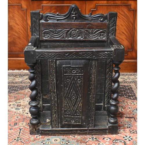 65A - An antique stained oak umbrella stand with barley-twist pillars and carved oak panels, 60 cm w x 36 ... 