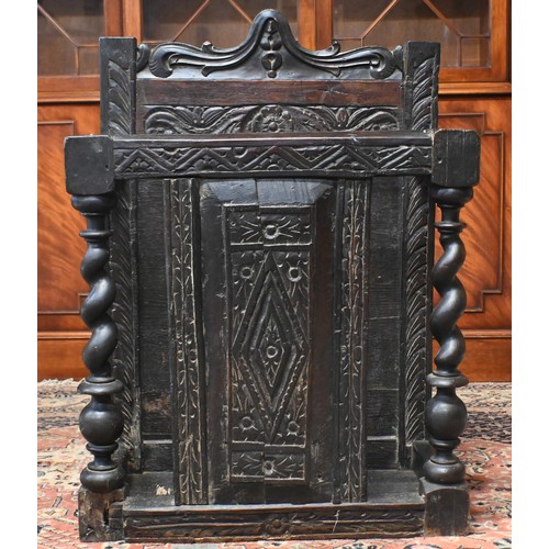 65A - An antique stained oak umbrella stand with barley-twist pillars and carved oak panels, 60 cm w x 36 ... 