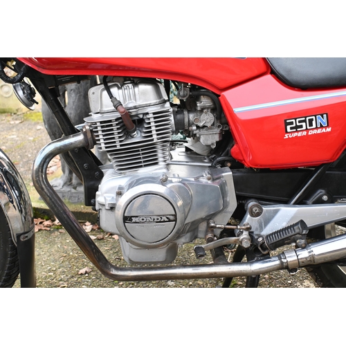 25 - A modern classic Honda 250N Super Dream motorcycle, 1982, reg. DGK 968X, red/chrome, showing 43,214 ... 