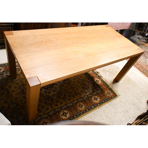 39 - A contemporary oak dining table, raised on square corner legs 180 cm w x 90 cm d x 77 cm h