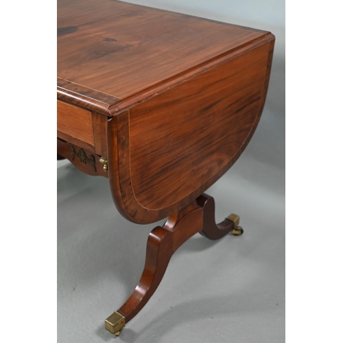 102 - A Regency cross-banded satinwood sofa table, the drop leaf top over two frieze drawers and opposing ... 