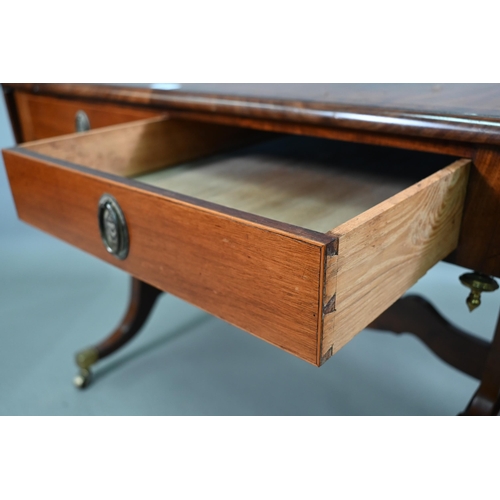 102 - A Regency cross-banded satinwood sofa table, the drop leaf top over two frieze drawers and opposing ... 