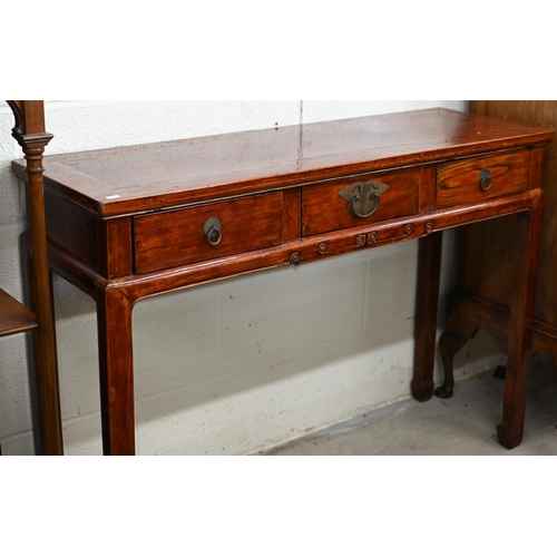 136 - A 20th century Chinese hardwood console/altar table with three drawers and brass handles, red lacque... 