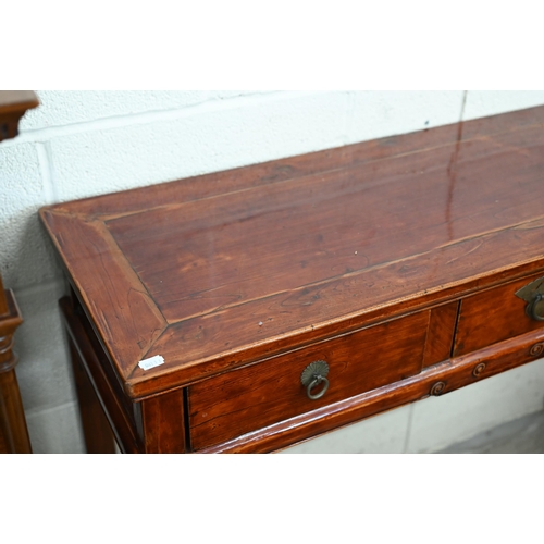 136 - A 20th century Chinese hardwood console/altar table with three drawers and brass handles, red lacque... 