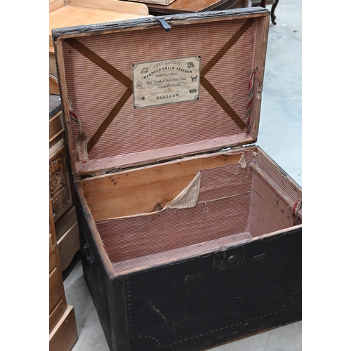 173 - An early/mid 19th century pine trunk covered in brass studded leather with side handles and ownershi... 