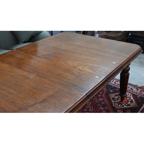 210 - A 19th century mahogany wind-out action extending dining table, the rounded rectangular top opening ... 