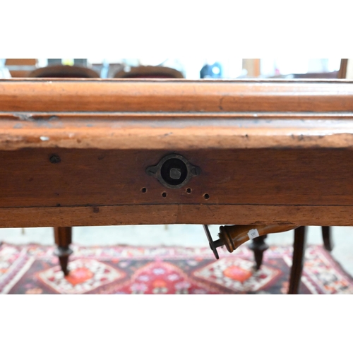 210 - A 19th century mahogany wind-out action extending dining table, the rounded rectangular top opening ... 